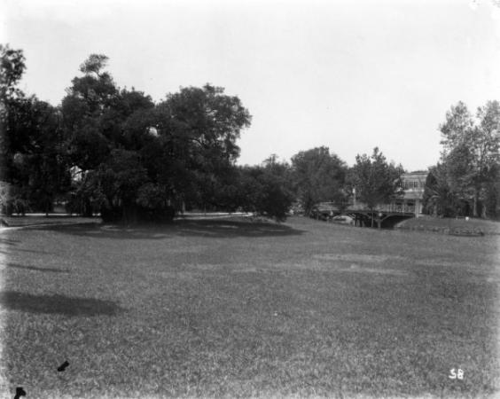 The original wooden bridge is seen in the distance. It was replaced by the Dreyfous Bridge.