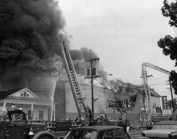 "Firefighters battle a fire at 2800 Grand Route St. John, April 9, 1966."