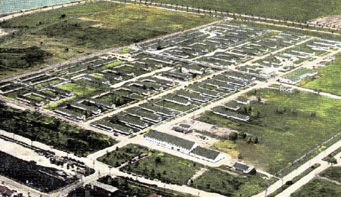 Aerial shot of streets in a grid pattern.