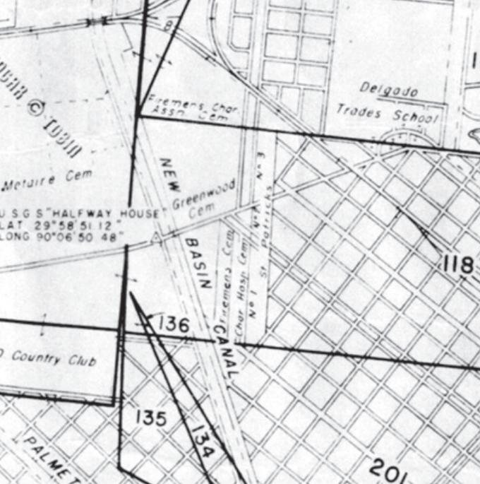 Black and white map featuring city squares and roads in the early twentieth century. The map features Delgado Trades School, New Basin Canal, and other New Orleans landmarks.