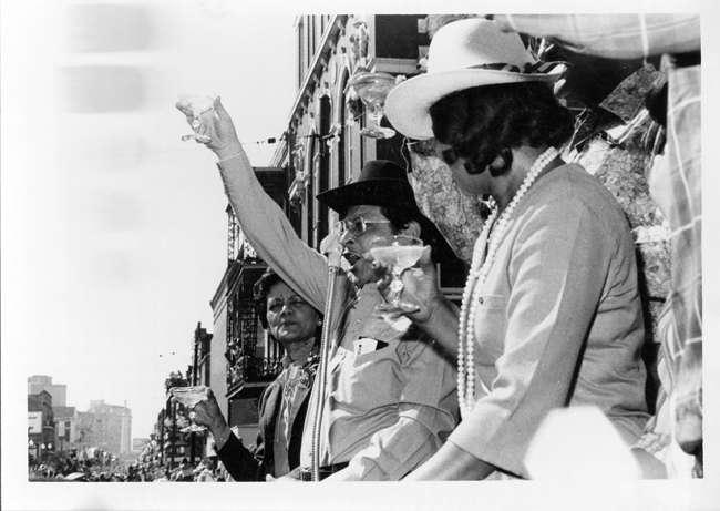 "Mayor and Mrs. Morial toast King and Queen Zulu in front of Gallier Hall, Mardi Gras Day"