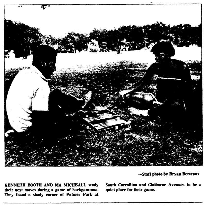 Two people playing backgammon in Palmer Park.