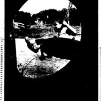 Child playing on a tire swing in Palmer Park.