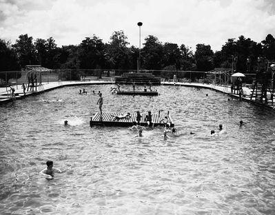 White children enjoy city's 2nd largest public swimming pool.