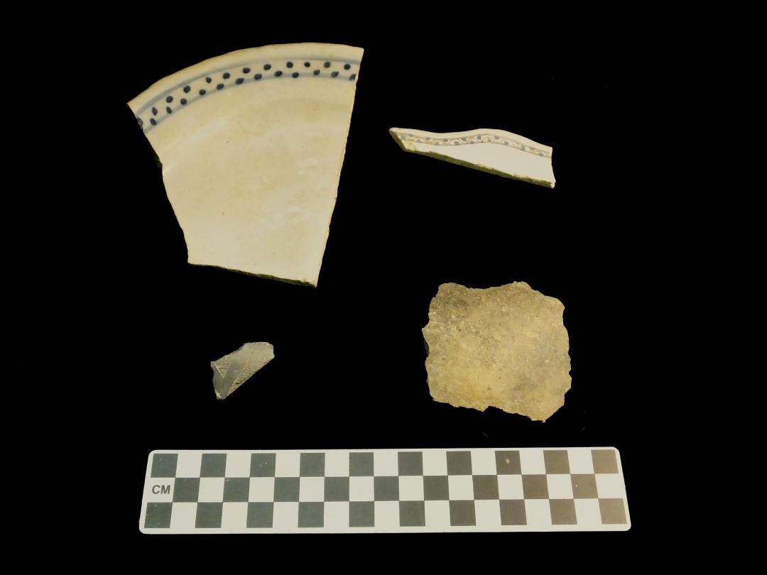 A mix of pottery: Tin-enameled European pottery (top) and Native pottery (bottom) from post-in-ground structure